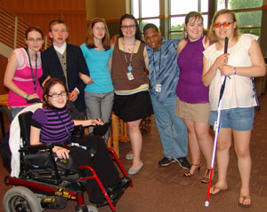 A diverse group of delegates pose for a photo